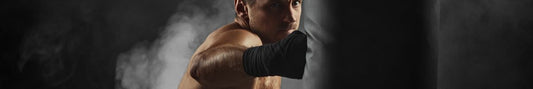 Boxer hitting a heavy bag during home training.