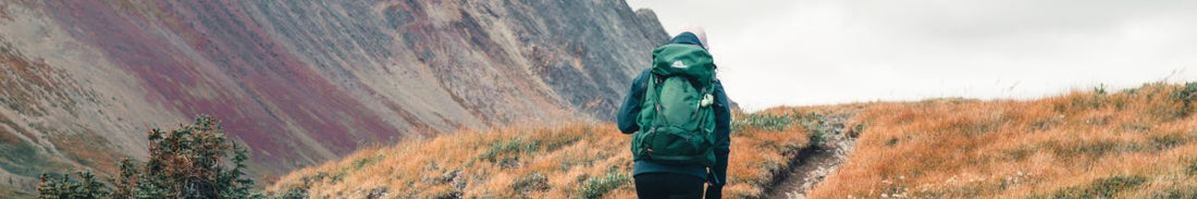 A woman wearing rucking boots in the mountains.
