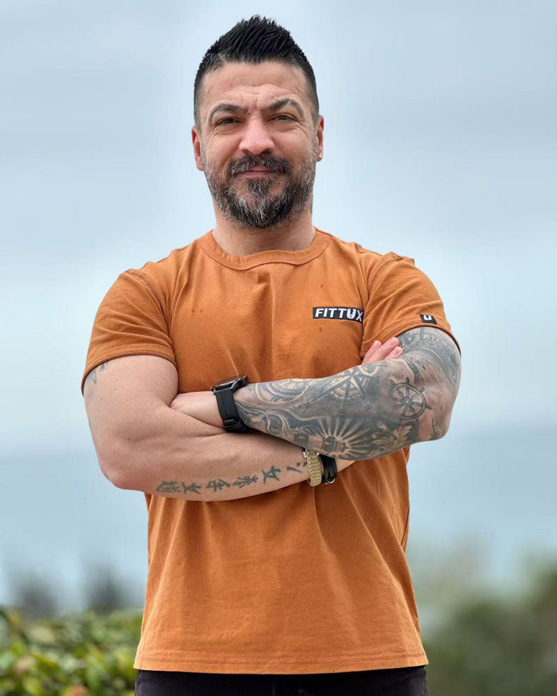 Taylor wearing our essential Fittux Sun-burnt orange t-shirt.